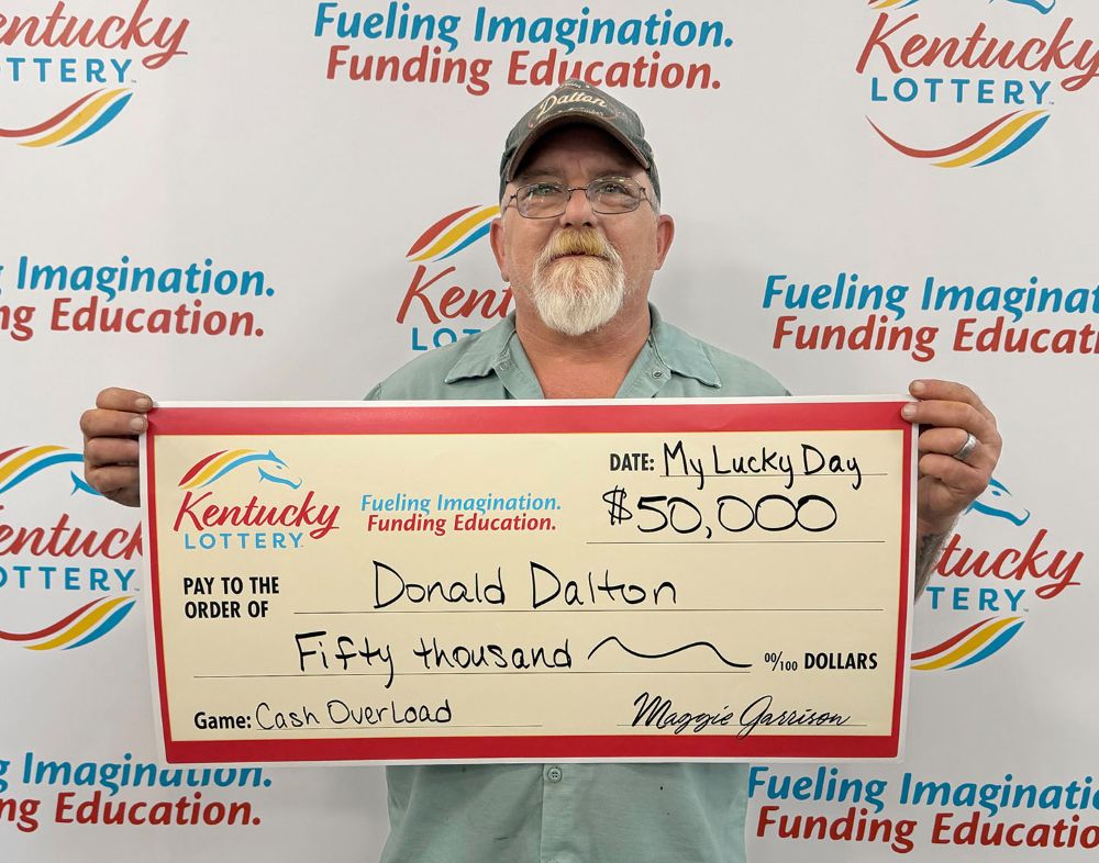 Image depicts the amount won on a specific lottery game. Winners may be in the image holding a large check made out to the amount they won. Clicking this image will open a new tab with that shows the story behind the win.