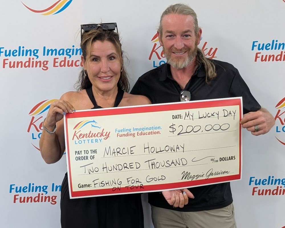 Image depicts the amount won on a specific lottery game. Winners may be in the image holding a large check made out to the amount they won. Clicking this image will open a new tab with that shows the story behind the win.