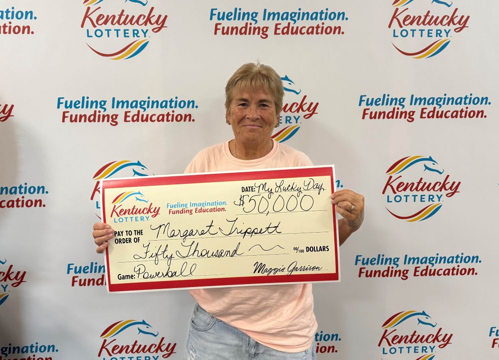 Image depicts the amount won on a specific lottery game. Winners may be in the image holding a large check made out to the amount they won. Clicking this image will open a new tab with that shows the story behind the win.