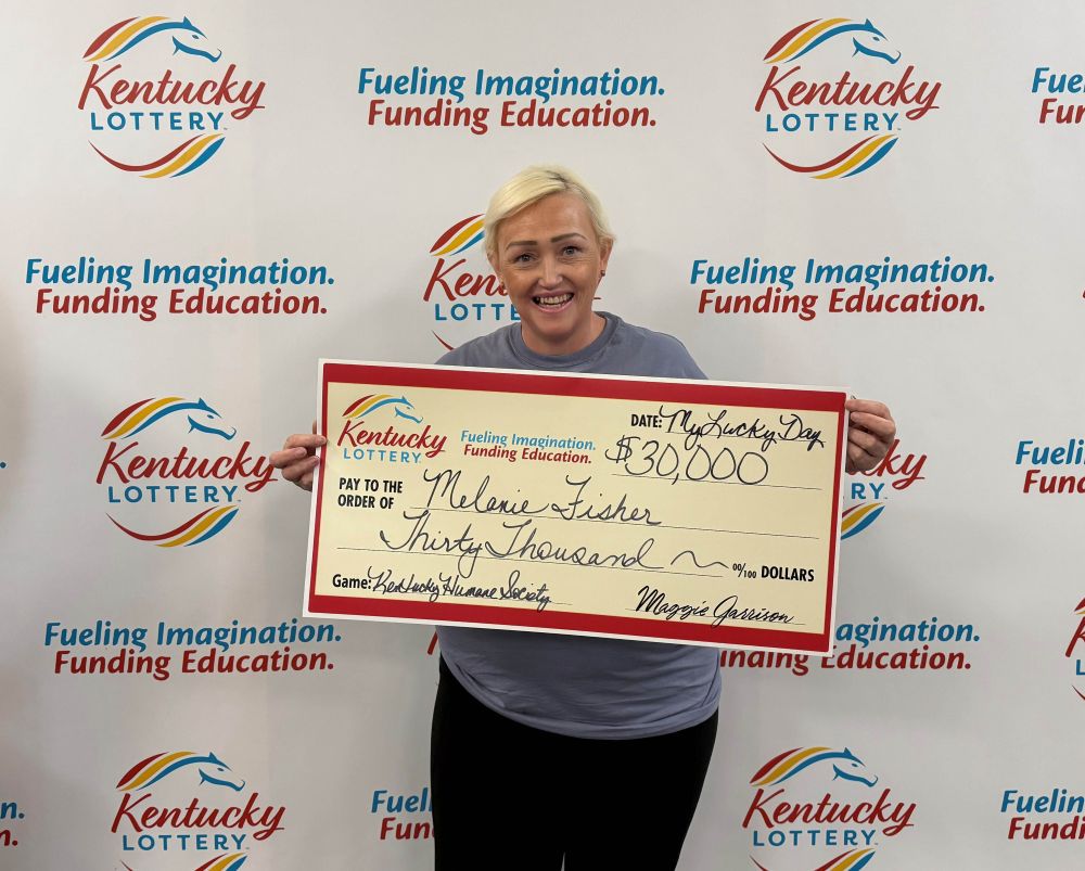Image depicts the amount won on a specific lottery game. Winners may be in the image holding a large check made out to the amount they won. Clicking this image will open a new tab with that shows the story behind the win.