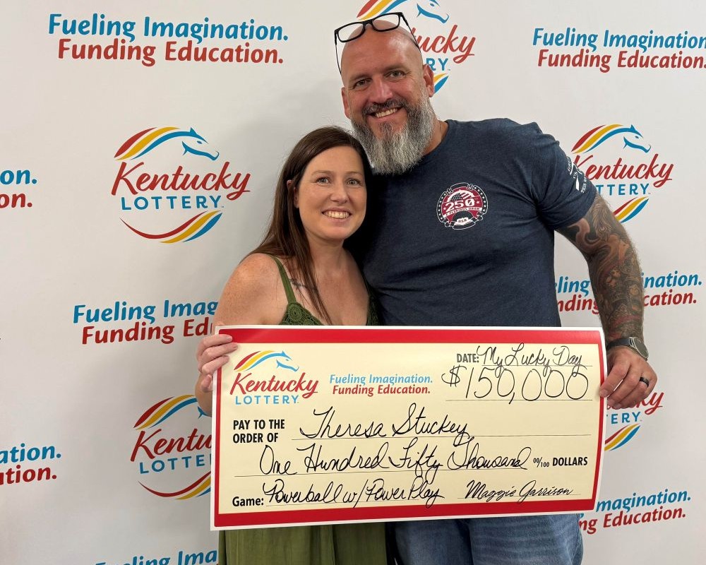 Image depicts the amount won on a specific lottery game. Winners may be in the image holding a large check made out to the amount they won. Clicking this image will open a new tab with that shows the story behind the win.