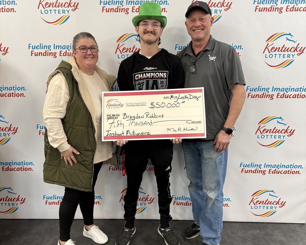 Frank Arrazola with Lottery President and CEO Maggie Garrison